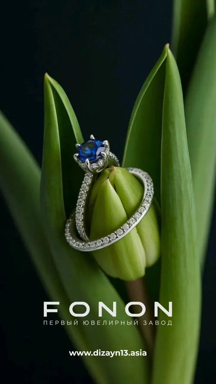 Sapphire ring wrapped around a green tulip bud