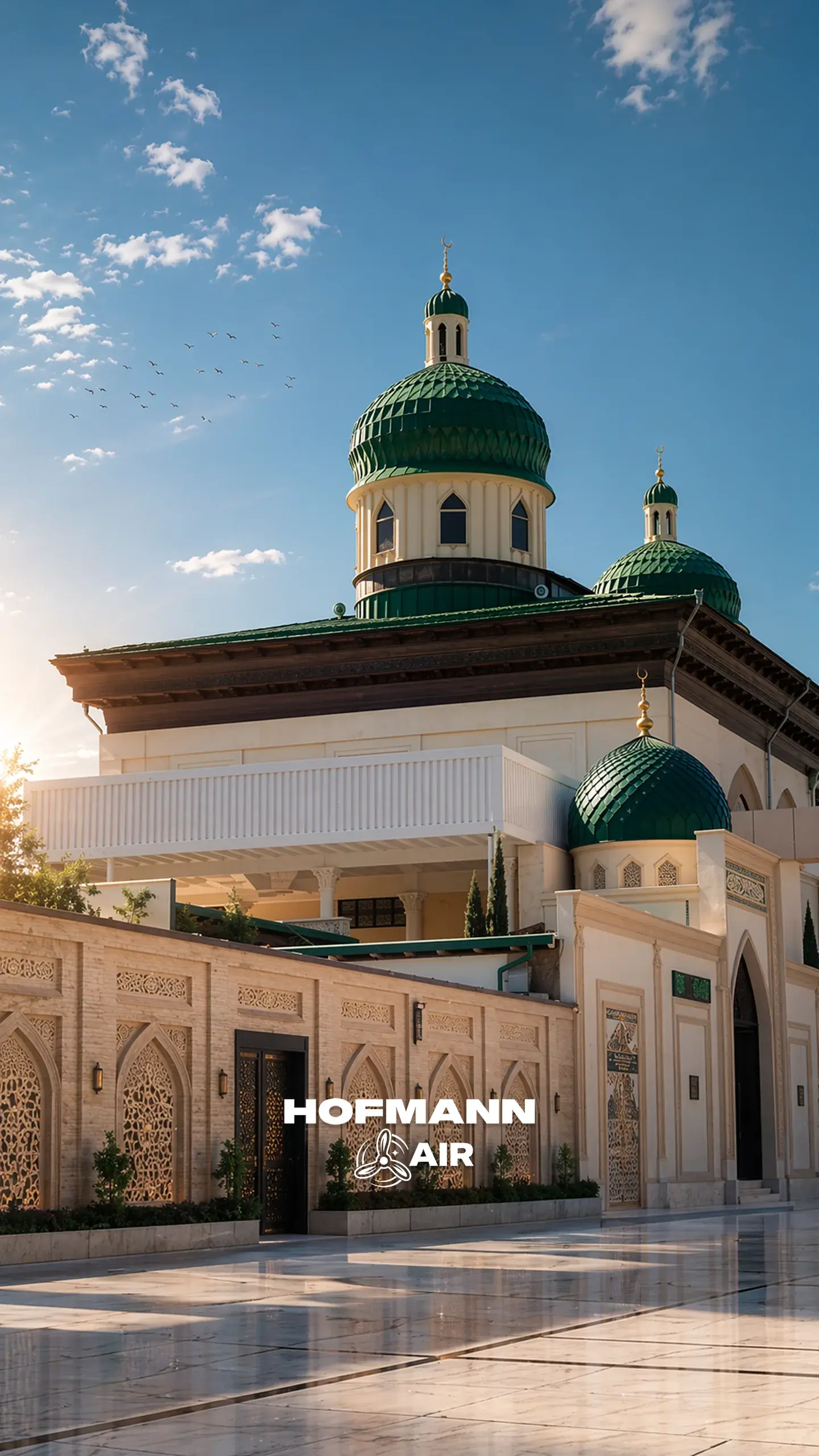 Mosque with green domes in sunlight with the Hofmann Air logo