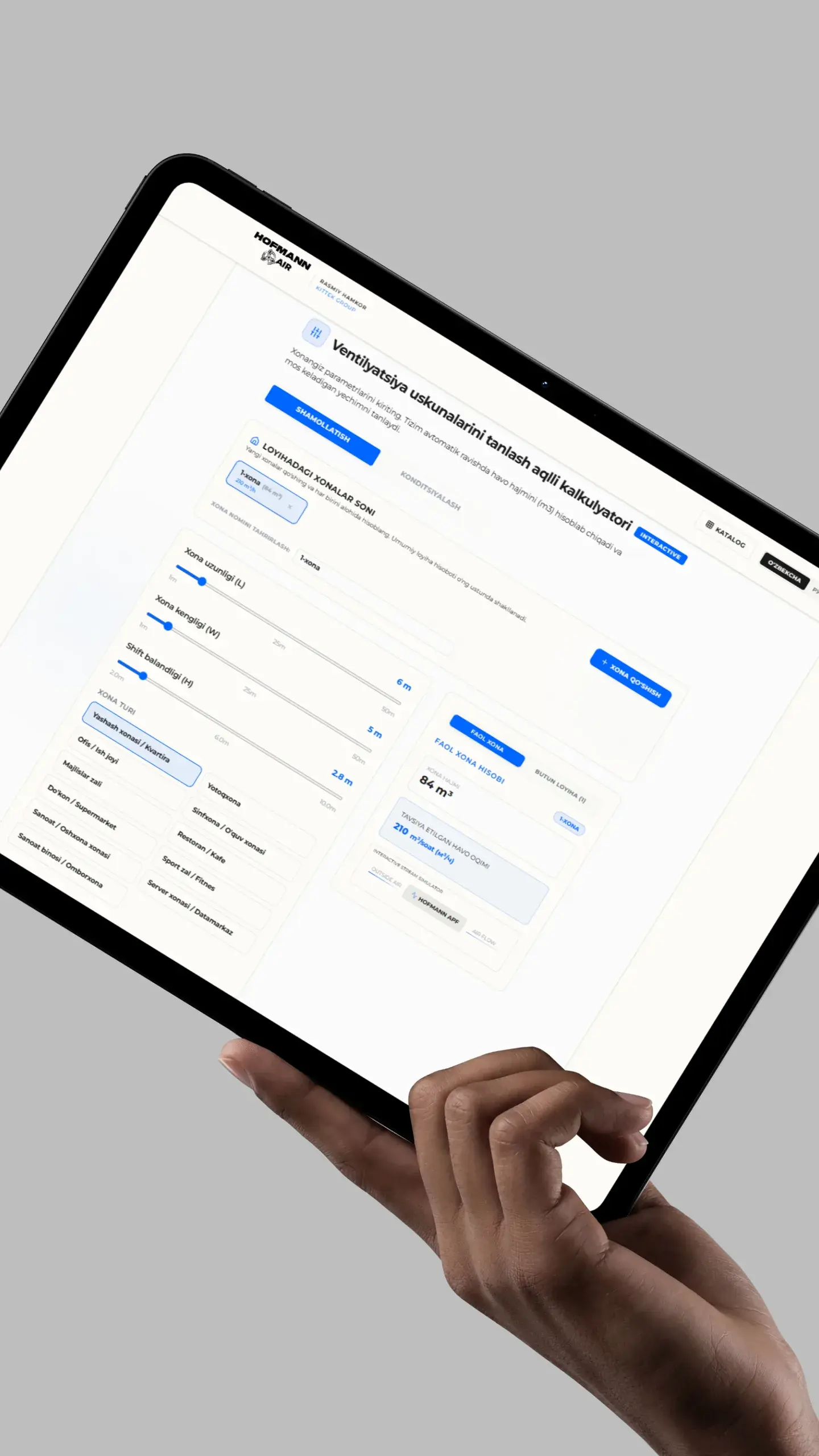 Interactive ventilation calculator on a tablet held in hand